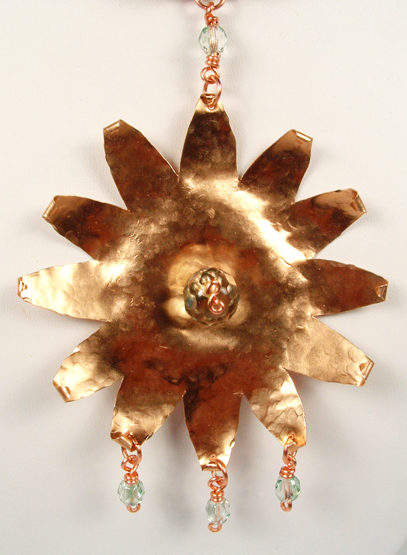 Close-up of the star-burst pendant.