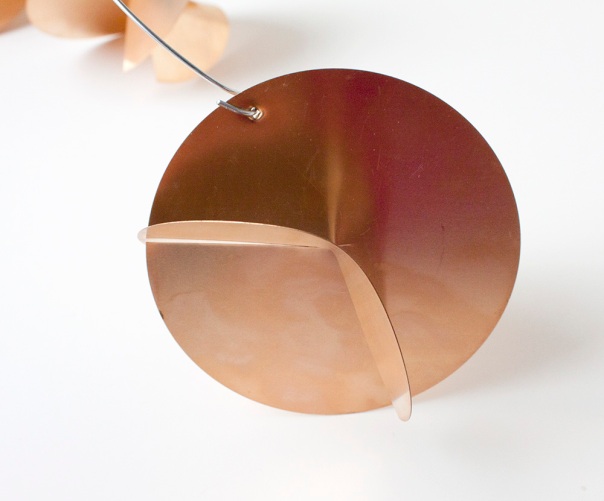 Round copper mobile shape